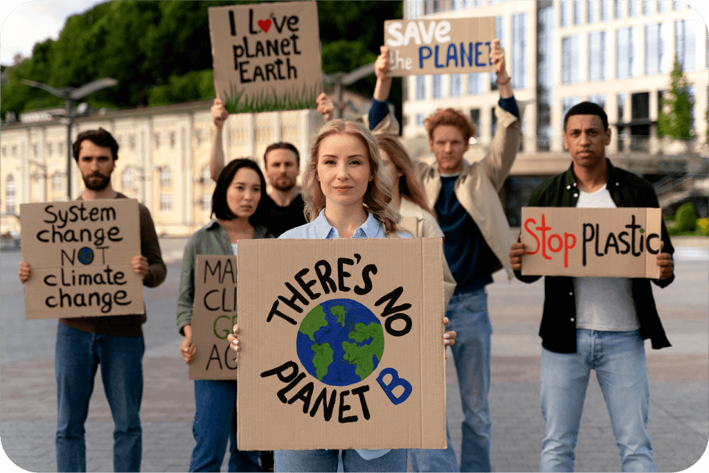 woman holding a sign saying There is no planet B