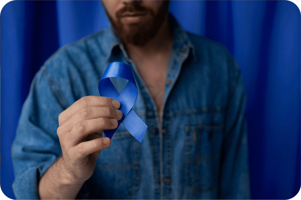 man with blue ribbon